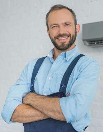 smiling-bearded-repairman-posing-with-crossed-arms-9WEV98W-2-1.jpg